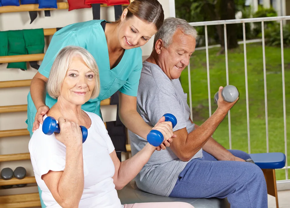 in-home-physical-therapy-for-seniors woman using hand peddle bike